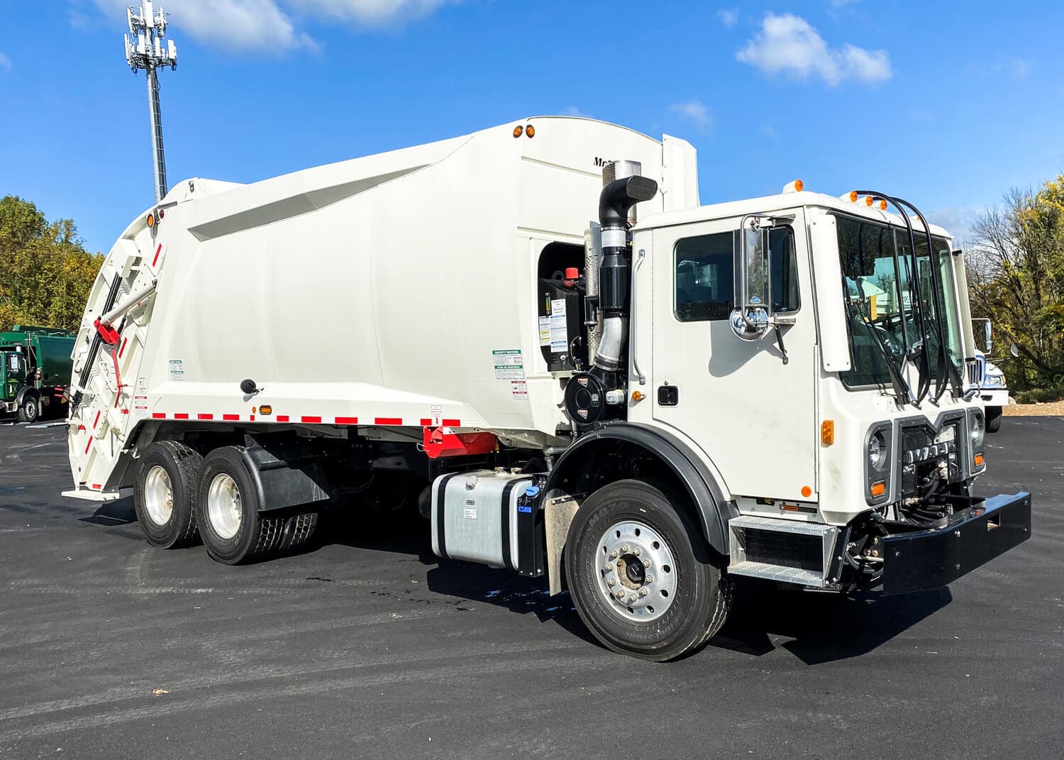 Red Bird Waste rear-loader trash truck on route in southern Wisconsin